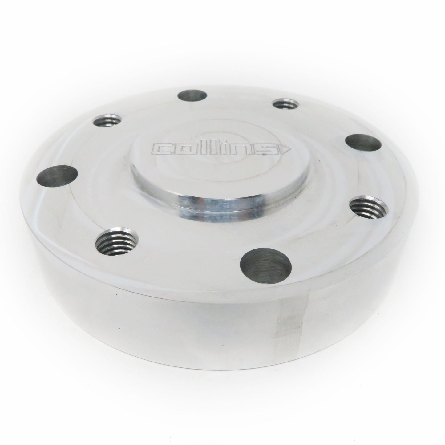 Aluminum round drive shaft adapter for BMW approximately 4 inches wide by 1 inch high