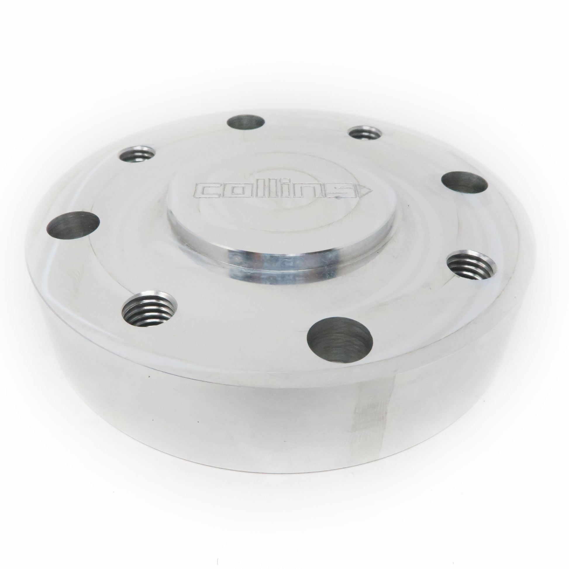 Aluminum round drive shaft adapter for BMW approximately 4 inches wide by 1 inch high