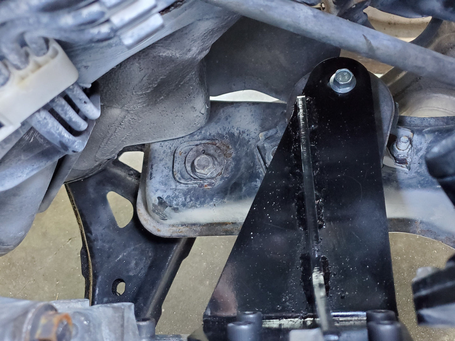 Steel powder coated engine mounts for the Honda K-Series to Mazda RX-8 installed in engine bay