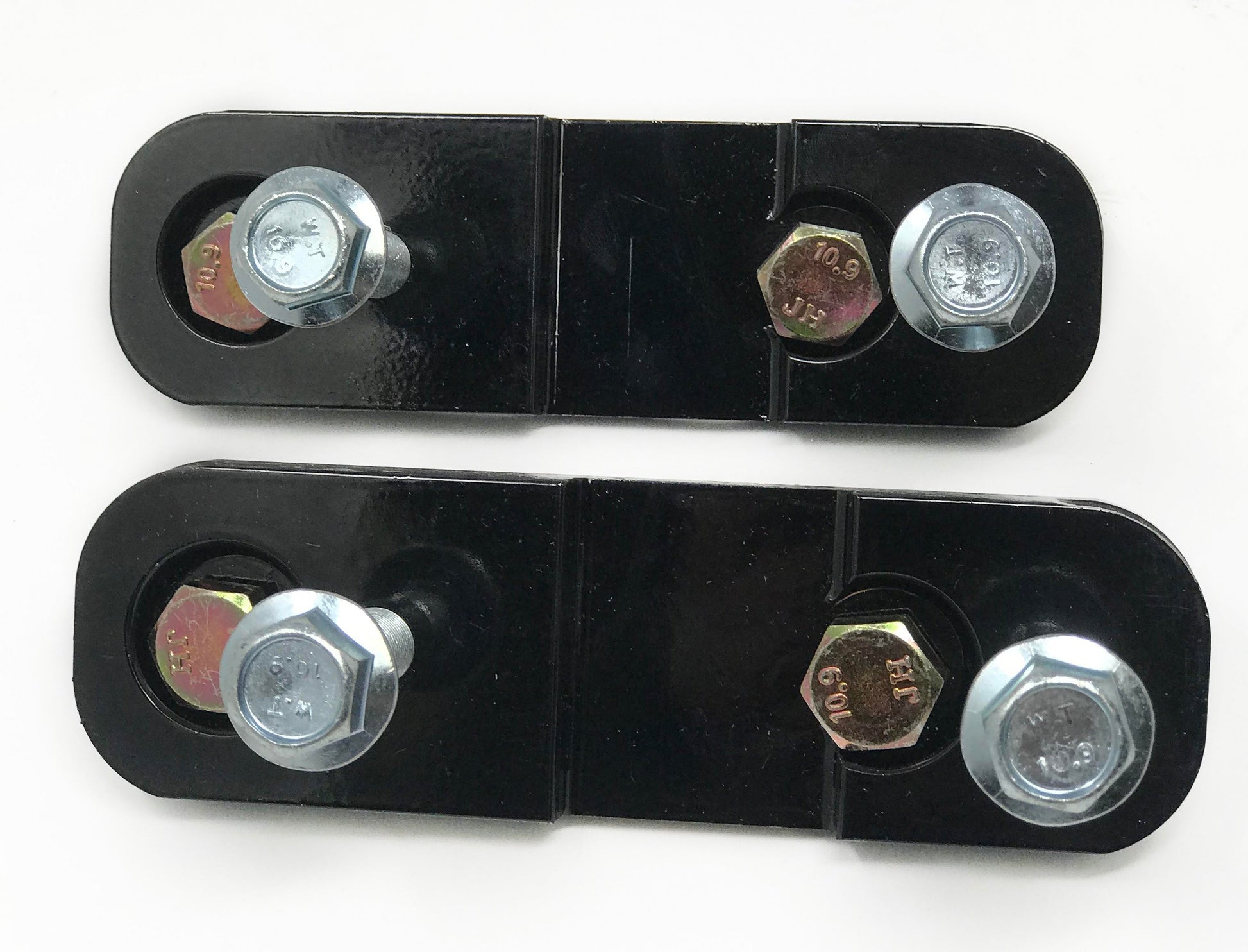 Powder coated steel spacers for relocating the rack in a k series to rx-8 application with hardware